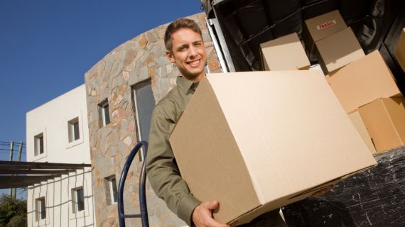 Ponte Vedra Movers crew carrying a box